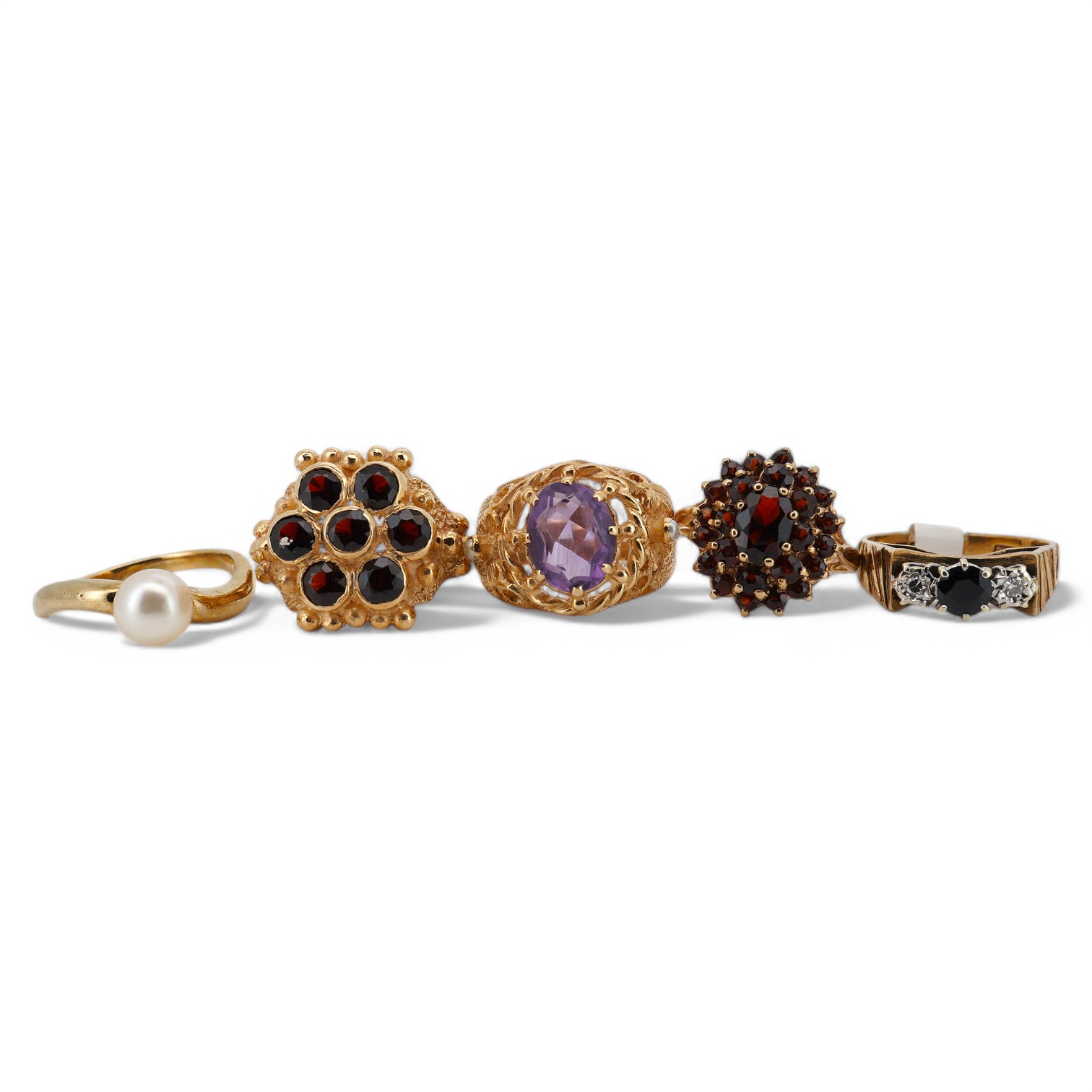 Five assorted modern 9ct gold and gem set rings, including two garner clusters, amethyst and seed pearl, sapphire and diamond chip and single stone cultured pearl, gross weight 20.6 grams. Condition - fair to good